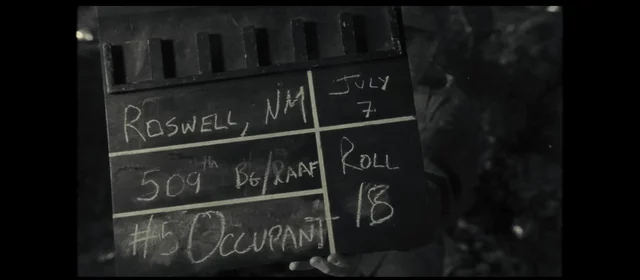 Film slate reading Roswell, NM, July 7, 509th BG/RAAF, Roll 18, #5 Occupant, from Steven Spielberg's Disclosure Day