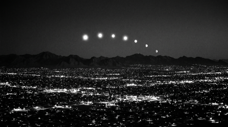Artistic recreation of the Phoenix Lights: an arc of glowing orbs over the city skyline at night