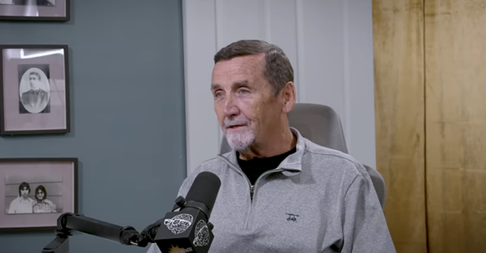Chris Bledsoe seated at a microphone during a recent interview
