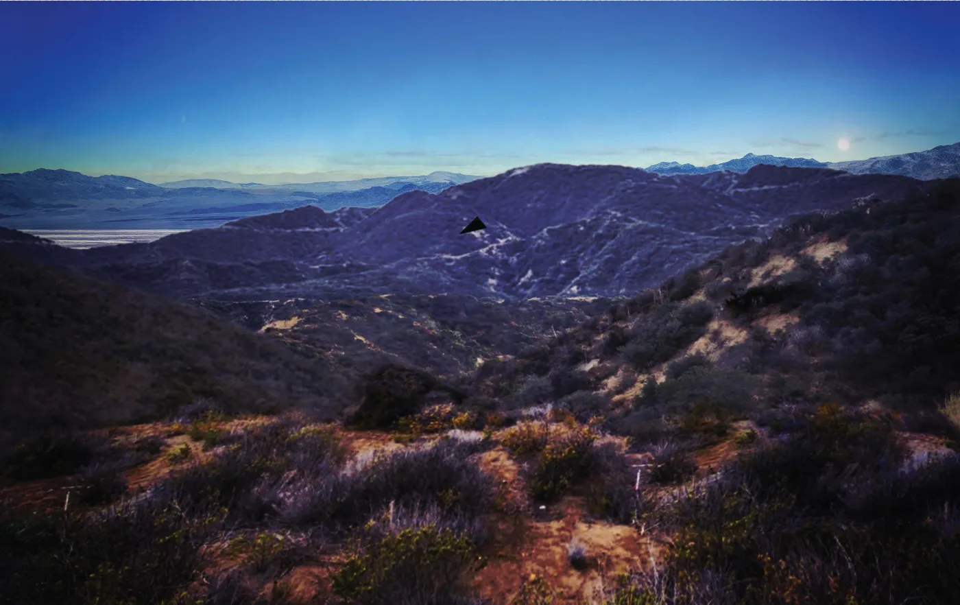Rendition of the black triangle reported by federal agents over a mountain ridgeline, from the FBI file released in PURSUE Release 07. Frame 3: the triangle moves across the ridge